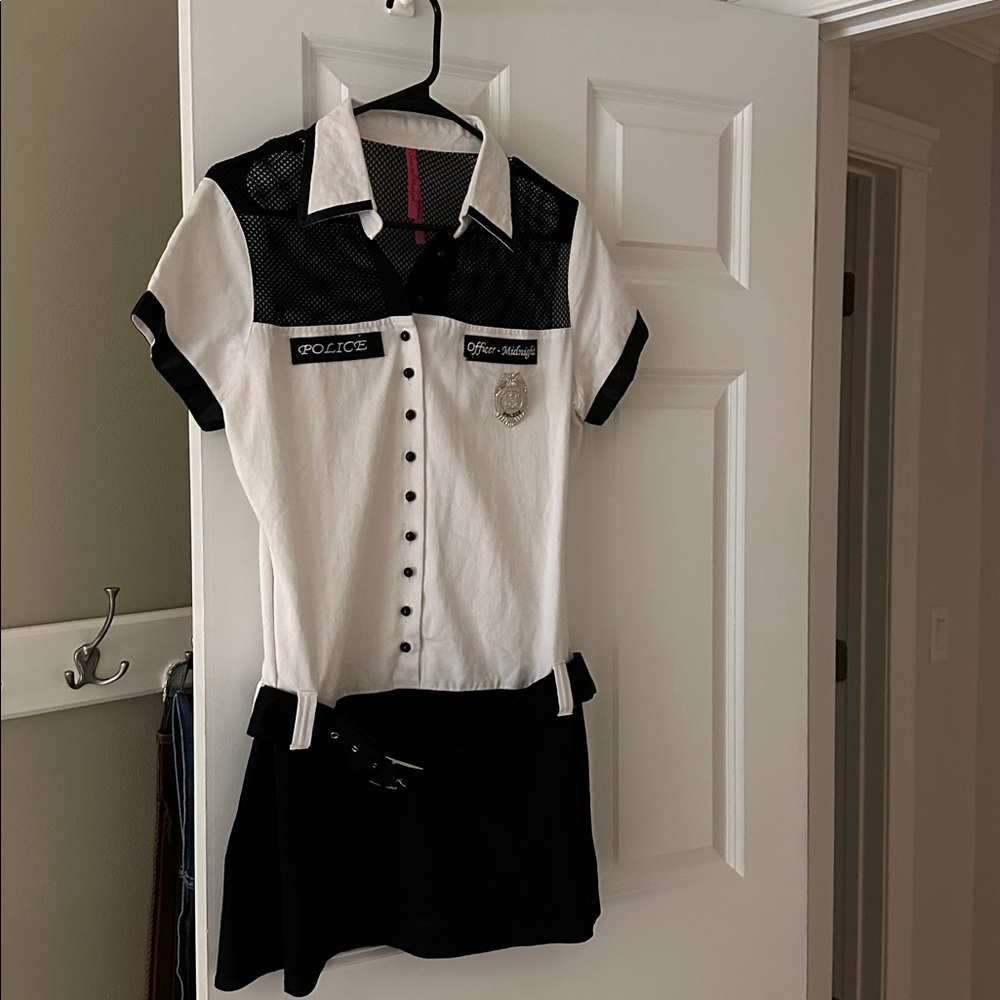 Halloween costume as sexy police with belt, gloves, baton, handcuffs